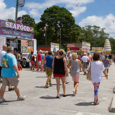 Croaker festival people walking in front of food vendors